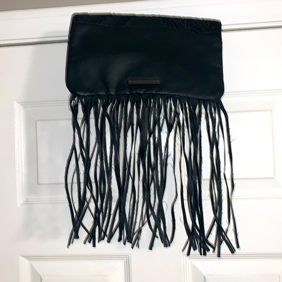 BCBGeneration black clutch bag. Snaps closed hanging leather strings. 2 zippers - Picture 3 of 9